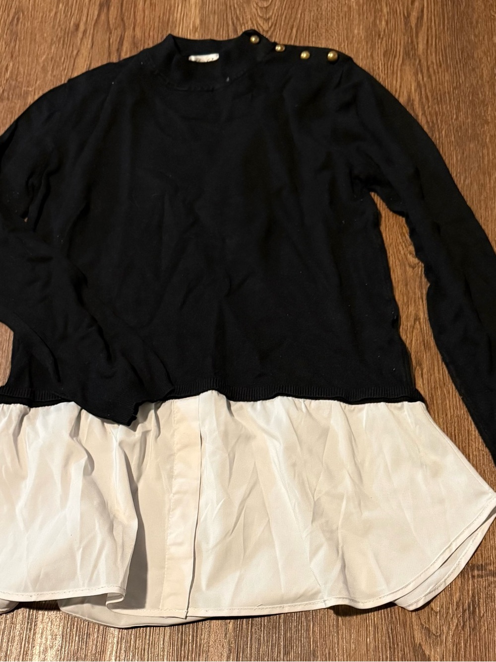 Cielo Black Sweater with Cream Layered Hem and Gold Shoulder Buttons